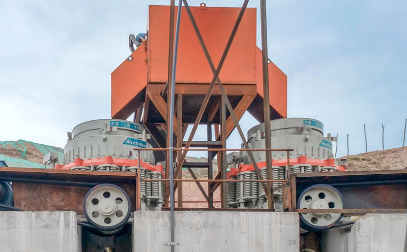 What is included in a cone crusher specification table?